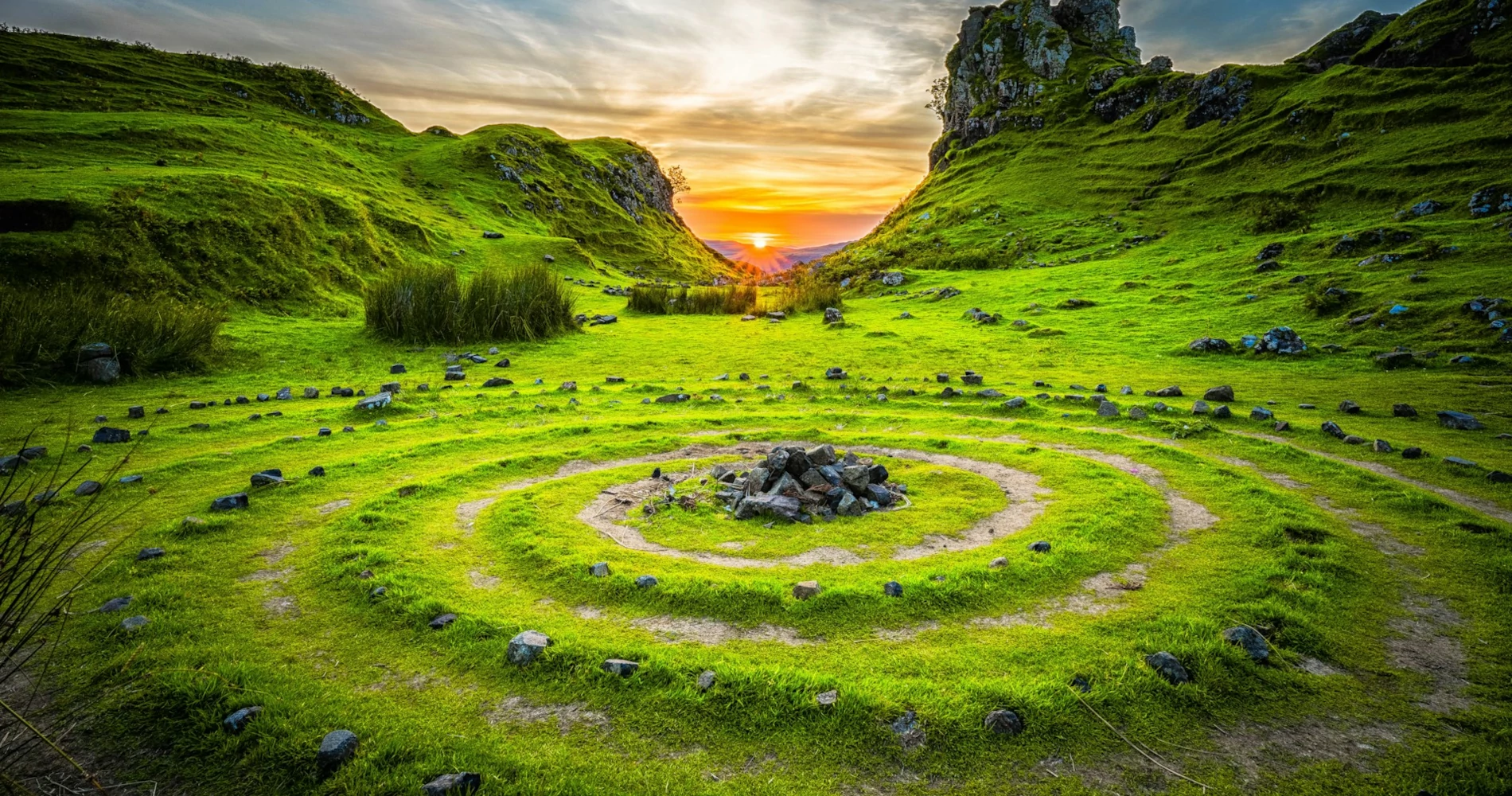 Ancient stone circle on a green grass field during sunset Ancient stone circle on a green grass field during sunset