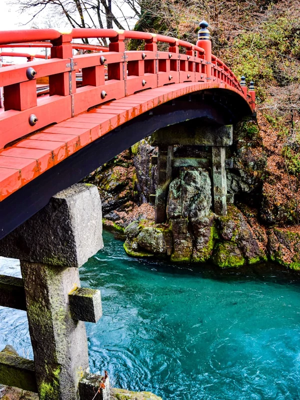 A red bridge over a river in Nikko, Japan
