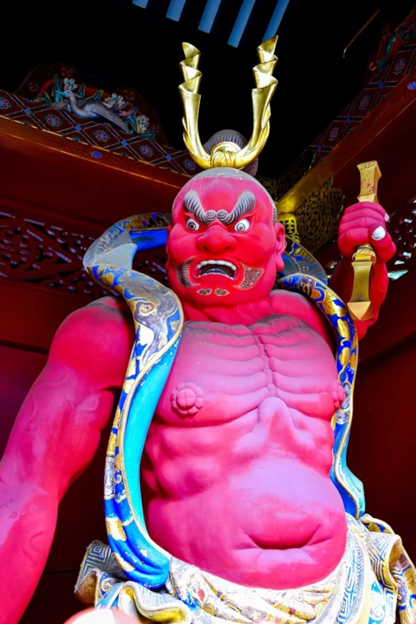 A red statue in Nikko Japan