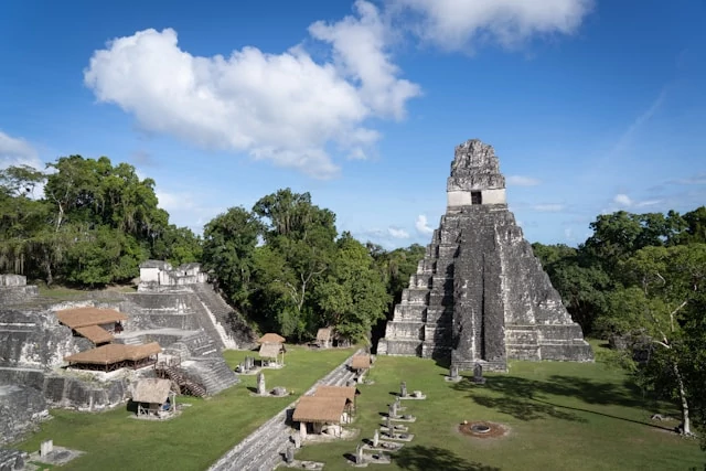 Ancient mayan ruins complex surrounded by lush jungle Ancient mayan ruins complex surrounded by lush jungle