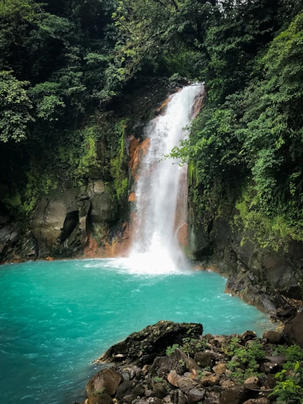Blue waterfall and river in the middle of the jungle Blue waterfall and river in the middle of the jungle