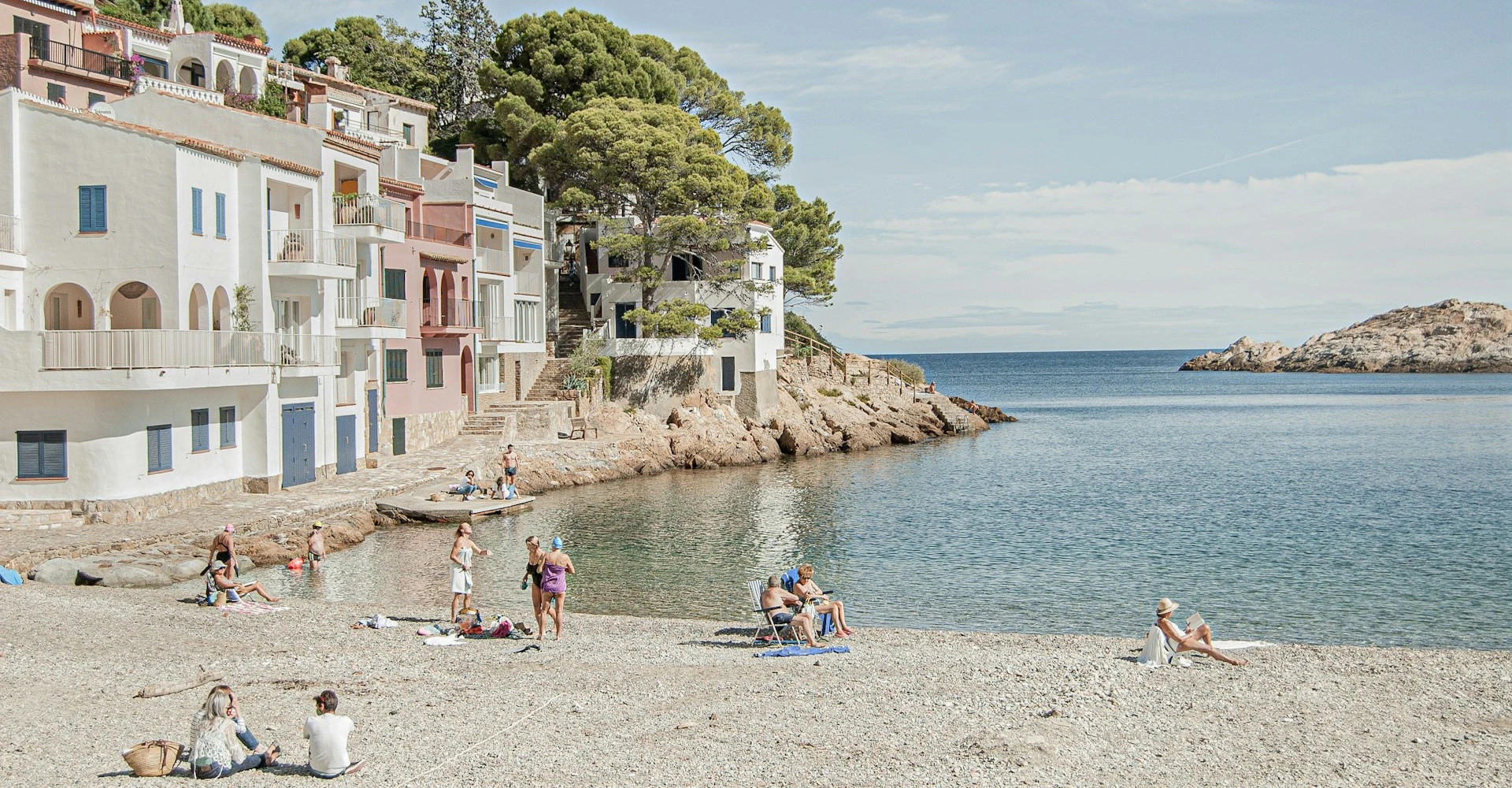 The tranquil beach of Sa Tuna on a sunny day and with a very calm sea