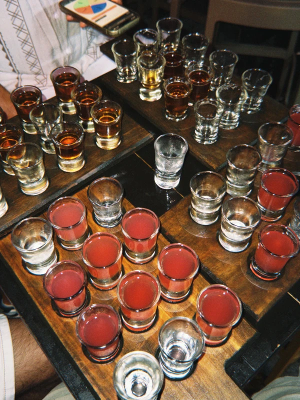 Table full of colorful shots in a lively bar in Paceville, Malta’s nightlife district.
