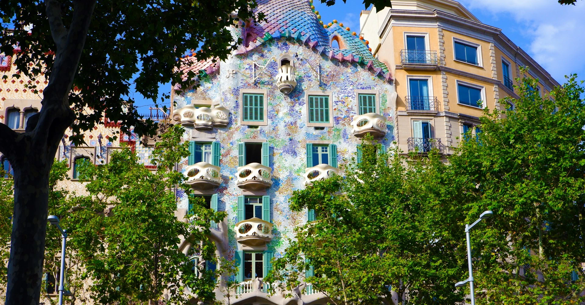 The colourful facade of the Casa Batlló on a sunny day