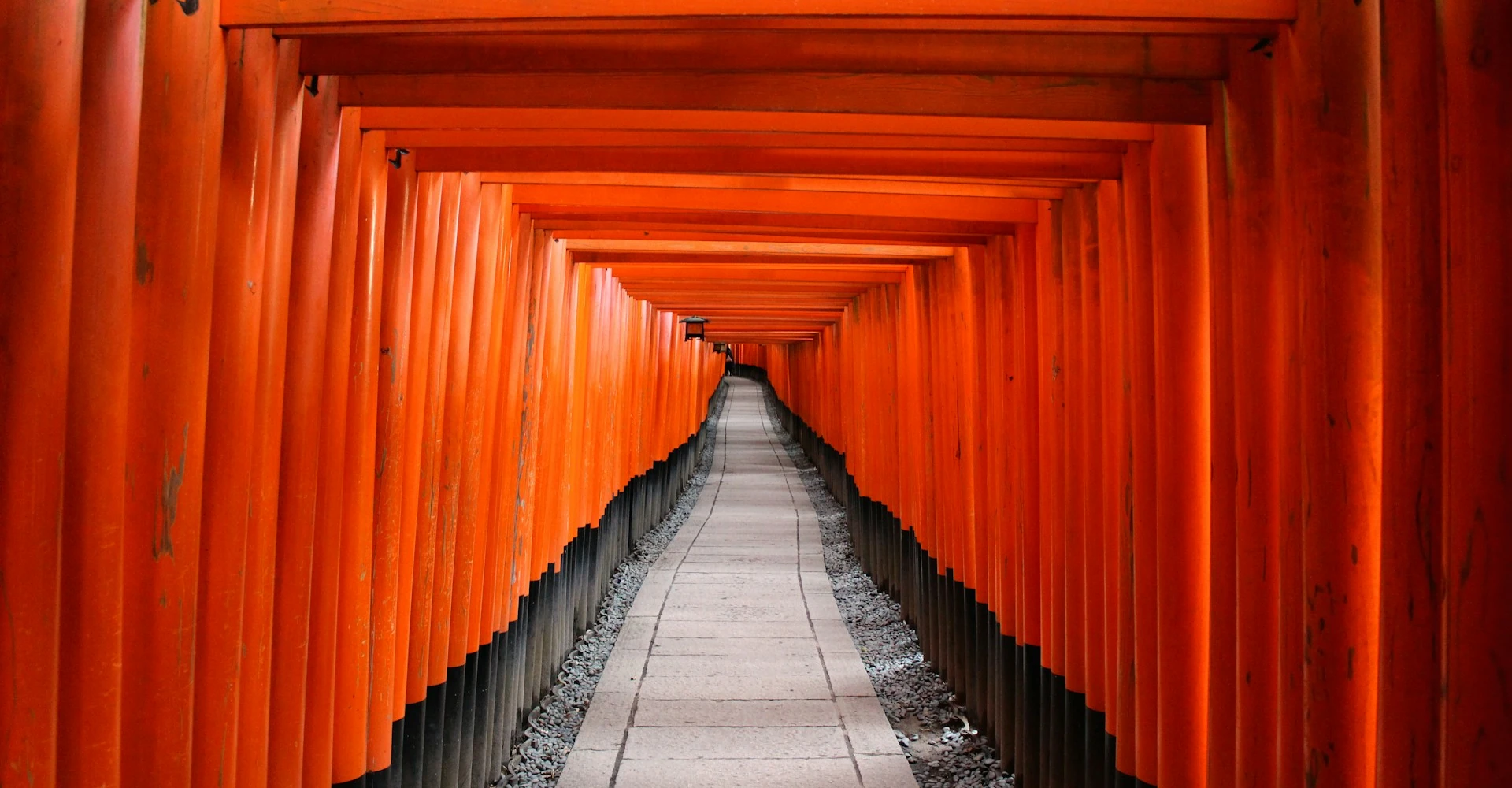 The iconic red torii gates of Fushimi Inari Taisha in Kyoto, Japan, a symbol of cultural and spiritual heritage