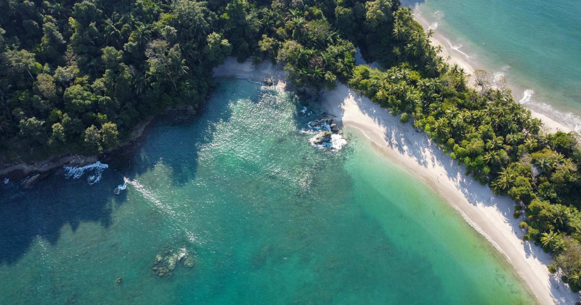 Playa Manuel Antonio, one of the best beaches of Costa Rica, and Playa Espadilla Sur from the air