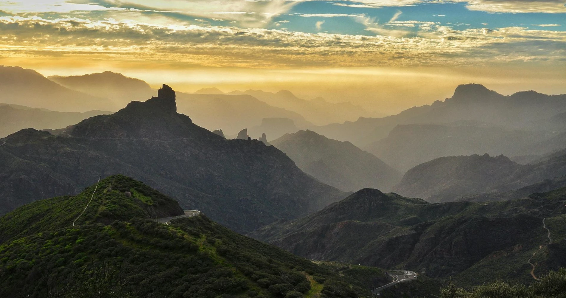 A cloudy sky above the foggy rugged mountains of Gran Canaria, in the Canary Islands.