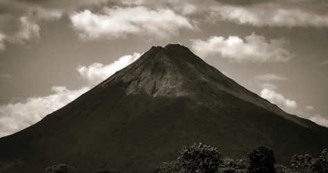 A black and white photo of Arenal volcano