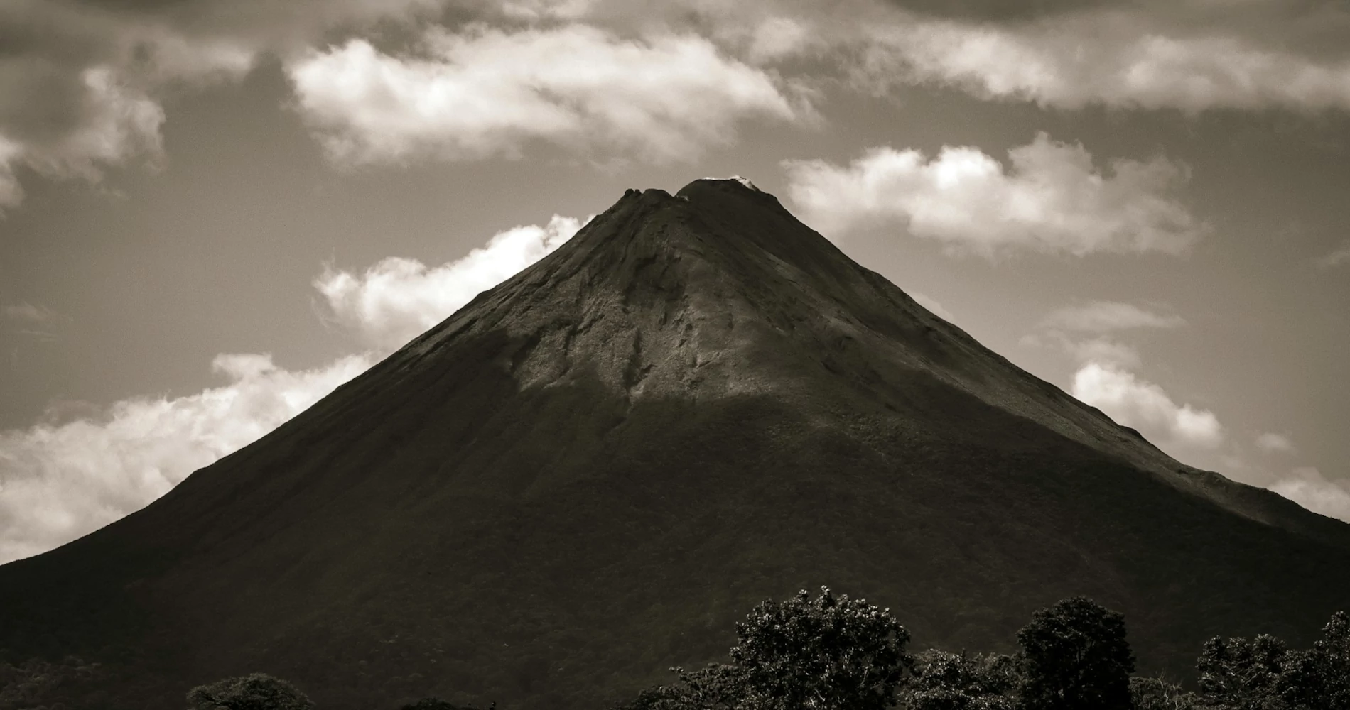 A black and white photo of Arenal volcano