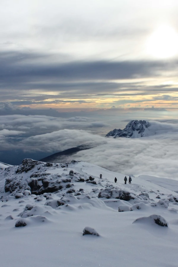 Sunrise above the clouds at Kilimanjaro in Tanzania. Just below the summit Uhuru Peak.
